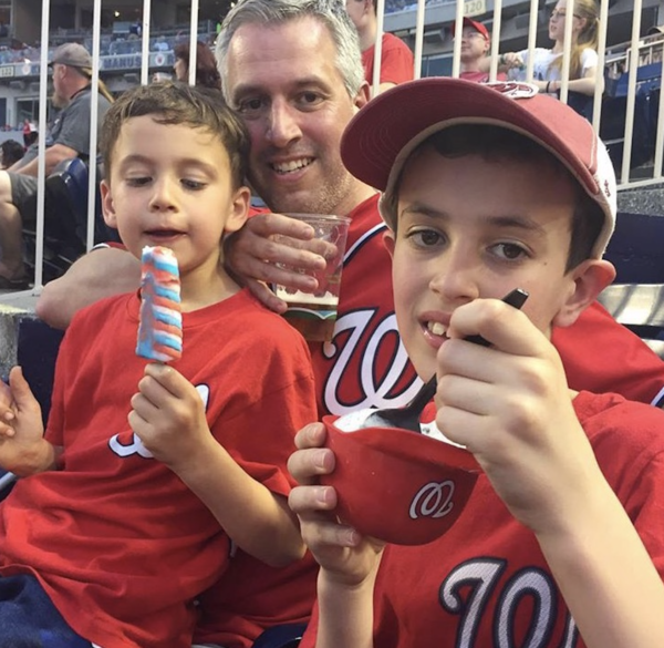 Nathan and his sons at a baseball game