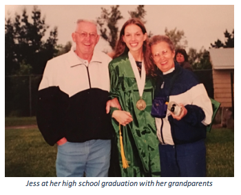 Jess at her high school graduation with her family