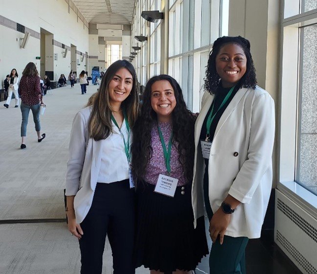 An image of FMPers posing for a group photo in a hallway at SIOP