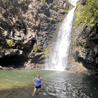 Shelby hiking at a remote spot located on the Road to Hana in Maui, Hawaii.